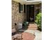 Inviting front porch with brick detail and a 'Welcome' sign at 125 Azalea Dr, Summerville, SC 29485