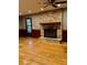 Cozy living room with a brick fireplace and hardwood floors at 125 Azalea Dr, Summerville, SC 29485