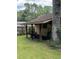 Outdoor shed featuring lawn equipment storage, side access and shaded location at 125 Azalea Dr, Summerville, SC 29485