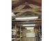 Storage shed featuring built-in shelves, a peg board, bright lighting and electrical outlets at 125 Azalea Dr, Summerville, SC 29485