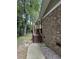 Charming side entrance with wooden stairs and a covered porch, perfect for enjoying the outdoors at 125 Azalea Dr, Summerville, SC 29485