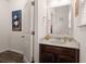 Well-lit half bathroom featuring a granite countertop and dark wood vanity at 150 Rockingham Way, Moncks Corner, SC 29461