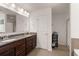 Elegant primary bathroom with double sinks, granite countertops, and modern fixtures at 150 Rockingham Way, Moncks Corner, SC 29461