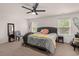 Comfortable primary bedroom with a ceiling fan and dual windows for ample natural light at 150 Rockingham Way, Moncks Corner, SC 29461