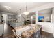 Open kitchen flows to the dining area, showcasing modern gray cabinets and granite countertops at 150 Rockingham Way, Moncks Corner, SC 29461
