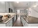 Modern kitchen with stainless steel appliances, grey cabinets, and a large kitchen island at 150 Rockingham Way, Moncks Corner, SC 29461