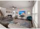 Comfortable living room features a large sectional sofa, TV, and lots of natural light at 150 Rockingham Way, Moncks Corner, SC 29461