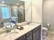 The bathroom has double sinks, modern countertops, and a glass shower enclosure at 1915 Sweetfern Rd, Hanahan, SC 29410