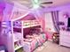 This whimsical bedroom features fun decor, including a bunk bed with decorative lighting at 1915 Sweetfern Rd, Hanahan, SC 29410