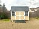 Attractive backyard storage shed with double doors and a durable roof at 1915 Sweetfern Rd, Hanahan, SC 29410