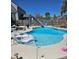 The backyard swimming pool features a slide and poolside lounge chairs at 1915 Sweetfern Rd, Hanahan, SC 29410