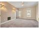 Neutral bedroom with carpet, two windows, and ensuite bath access at 193 Shadowmoss Pkwy, Charleston, SC 29414