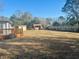 View of large backyard, wood deck, and storage shed, offering ample space at 2005 Saint David Ln, Charleston, SC 29414