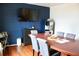 Spacious dining room with a large table, media center, accent wall, and built in bookcase at 2008 Cosgrove Ave, North Charleston, SC 29405