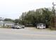 Street view of charming blue home with ample parking at 2008 Cosgrove Ave, North Charleston, SC 29405