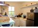Bright kitchen with stainless steel fridge, white cabinets, butcher block countertops, and natural light at 2008 Cosgrove Ave, North Charleston, SC 29405