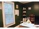 Home office with a large window and stylish decorations on the shelves at 2008 Cosgrove Ave, North Charleston, SC 29405
