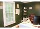 Bright home office with large window, shelving unit, and desk space at 2008 Cosgrove Ave, North Charleston, SC 29405