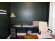 Home office featuring a stylish lamp, white chair, and desk with drawers at 2008 Cosgrove Ave, North Charleston, SC 29405