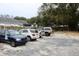 Gravel parking lot behind property featuring ample space for three vehicles at 2008 Cosgrove Ave, North Charleston, SC 29405