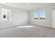 Carpeted bedroom featuring two windows that illuminate the room with light at 212 Denham St, Summerville, SC 29486