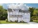 Charming two-story home with light blue siding, covered front porch, and attached two-car garage at 212 Denham St, Summerville, SC 29486