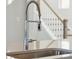 Close-up of a kitchen sink with stainless steel faucet and white countertops at 212 Denham St, Summerville, SC 29486