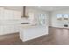 Modern kitchen with white cabinets, large island, stainless steel appliances, and water views at 212 Denham St, Summerville, SC 29486