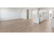 Bright living room with light hardwood floors and an adjacent kitchen space at 212 Denham St, Summerville, SC 29486