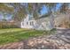 Charming side exterior view of a two-story home, featuring a well-maintained lawn and driveway at 2181 Edisto Ave, Charleston, SC 29412