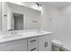 Bright bathroom features a double sink vanity, white cabinets, and a large mirror at 2185 Helm Ave, North Charleston, SC 29405