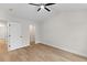 Bright bedroom with wood-look flooring, a doorway to a closet and a double window at 2185 Helm Ave, North Charleston, SC 29405