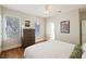 This cozy bedroom features hardwood floors, multiple windows, and great natural light at 249 Ashley Ave, Charleston, SC 29403