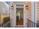 Inviting entryway with hardwood floors, views into the home, and classic sconce lighting at 249 Ashley Ave, Charleston, SC 29403