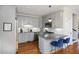 Bright kitchen featuring stainless steel appliances and gray cabinetry with granite counters at 249 Ashley Ave, Charleston, SC 29403