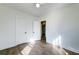 Bright bedroom features neutral walls, a ceiling fan, and stylish wood-look flooring at 2694 Olympia Ave, North Charleston, SC 29405
