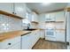 Modern kitchen with white cabinets, butcher block countertop, and subway tile backsplash at 2694 Olympia Ave, North Charleston, SC 29405