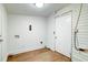 Spacious laundry room featuring bead-board walls and stylish wood-look flooring at 2694 Olympia Ave, North Charleston, SC 29405
