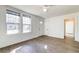 Bright, airy living room with wood floors, ceiling fan, and many windows at 2694 Olympia Ave, North Charleston, SC 29405