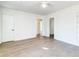 Bright, airy living room with wood floors, ceiling fan, and many windows at 2694 Olympia Ave, North Charleston, SC 29405