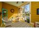 Sun-drenched porch featuring wicker furniture and an open view to an outdoor patio at 297 Hundred Oaks Pkwy, Summerville, SC 29483