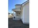 Back porch is complete with an awning, a single window, vinyl siding, and clean concrete at 3004 Harvey Ave, North Charleston, SC 29405