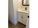 Bathroom featuring white vanity with black hardware and wood floor at 3004 Harvey Ave, North Charleston, SC 29405