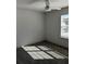 Bedroom with neutral carpet, ceiling fan, window, and white walls at 3004 Harvey Ave, North Charleston, SC 29405