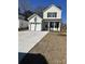 Charming two-story home featuring a welcoming front lawn and private garage at 3004 Harvey Ave, North Charleston, SC 29405