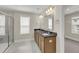 Bathroom featuring double vanity with framed mirror, natural light, and glass shower at 304 O'Malley Dr, Summerville, SC 29483