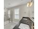 Bathroom showcasing a double vanity, framed mirror, natural light, and glass shower at 304 O'Malley Dr, Summerville, SC 29483