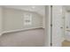 Neutral bedroom featuring a window and plush carpet at 304 O'Malley Dr, Summerville, SC 29483