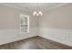 Cozy dining room featuring neutral walls, wainscoting and a modern light fixture at 304 O'Malley Dr, Summerville, SC 29483