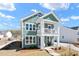 Charming two-story home featuring a covered porch and a well-maintained front yard at 304 O'Malley Dr, Summerville, SC 29483